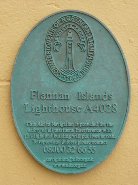 Memorial plaque at Flannan Isles Lighthouse naming James Ducat, Thomas Marshall and Donald McArthur.
